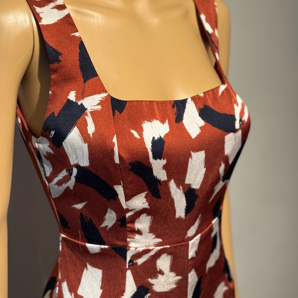 Want major power vibes? This Lush silky deep orange, navy& white jumpsuit is it